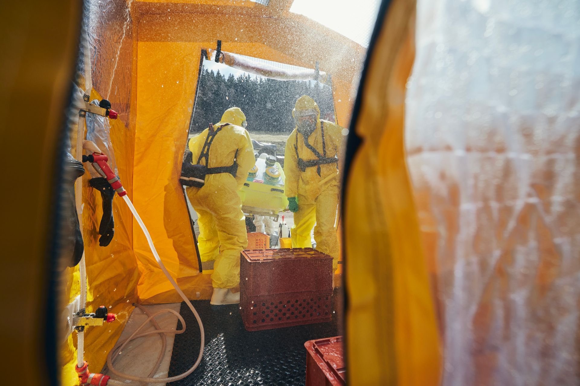 Hazmat emergency response team conducting biohazard decontamination during active incident response
