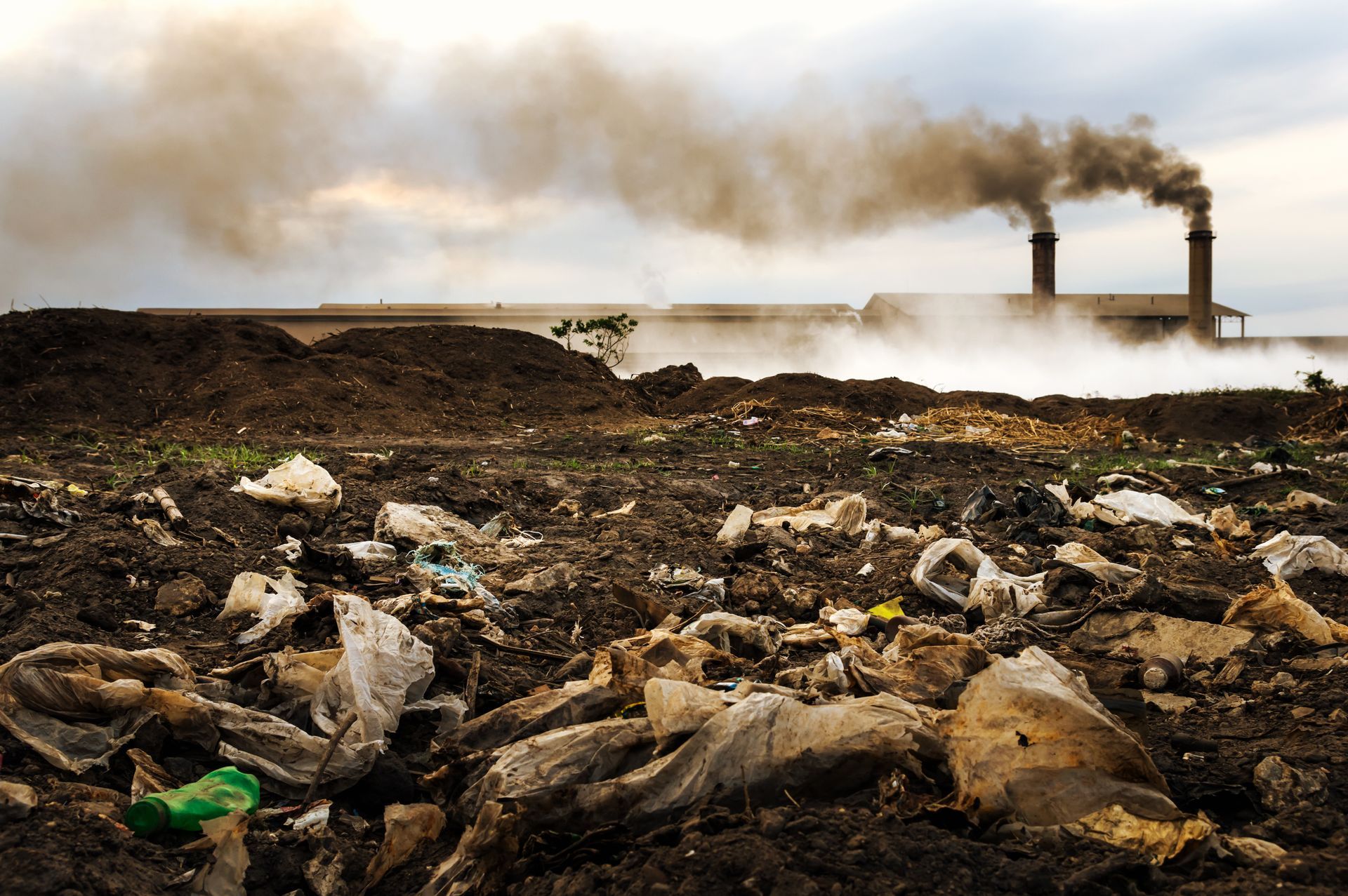 Industrial waste accumulation at manufacturing plant requiring regulated waste disposal