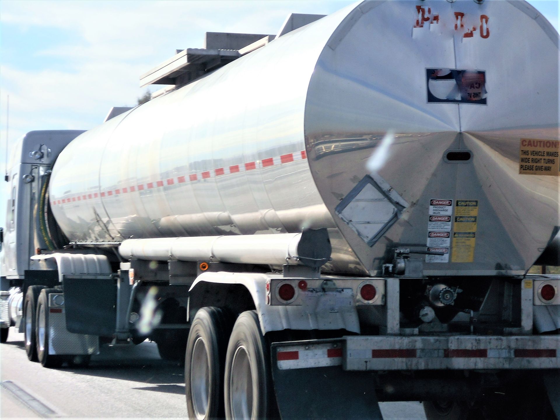 Liquid waste tanker truck collecting high-strength process wastewater from a food and beverage processing plant
