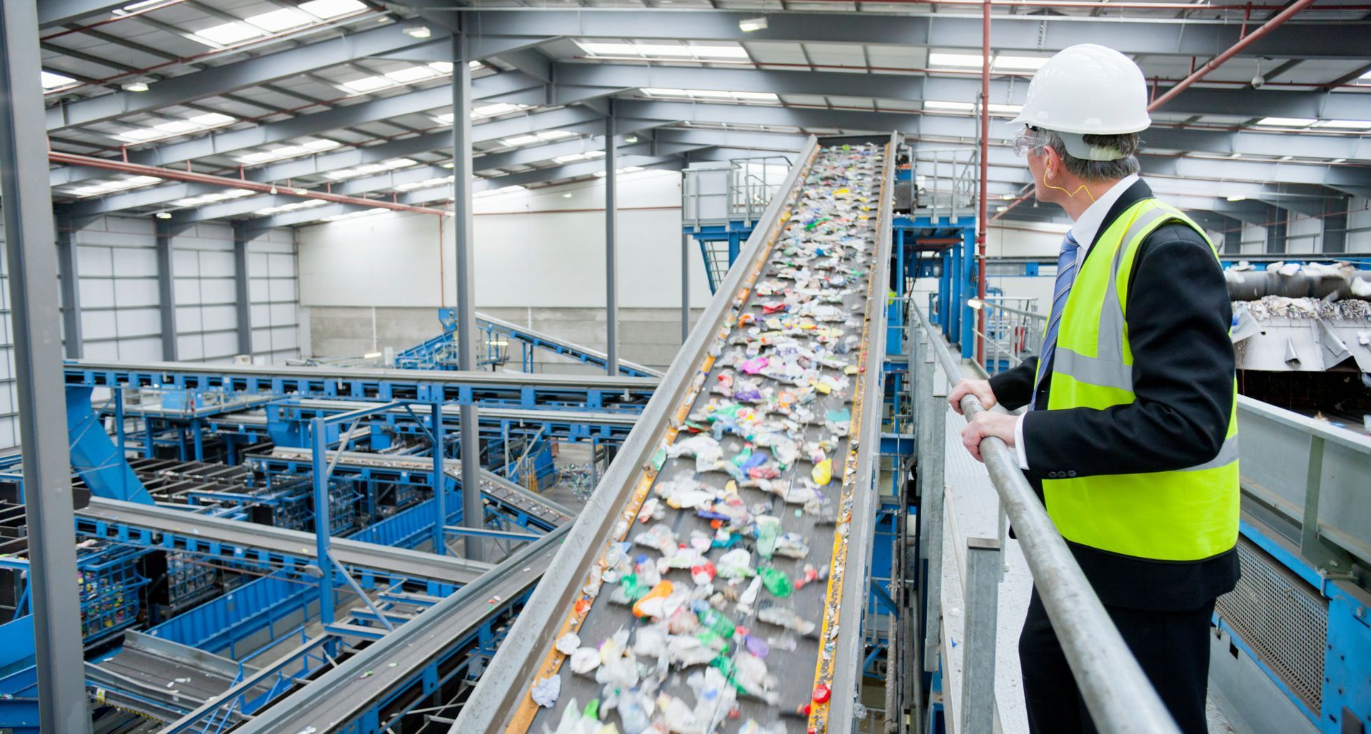 Industrial waste recycling program processing mixed materials on automated sorting line