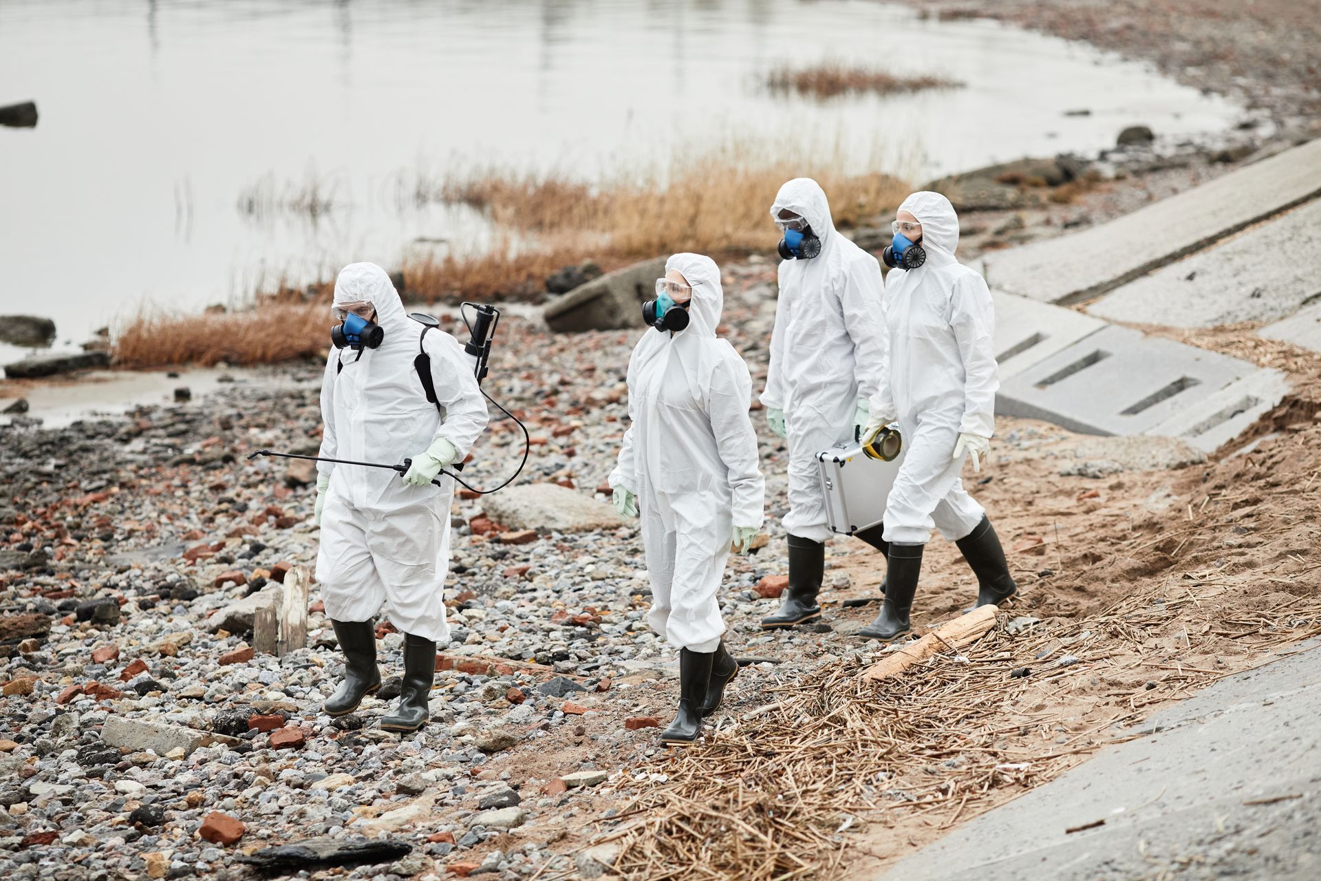 Hazmat response team managing high-risk chemical materials at a contaminated pharmaceutical site