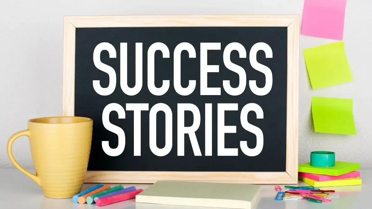 A blackboard with the words `` success stories '' written on it.
