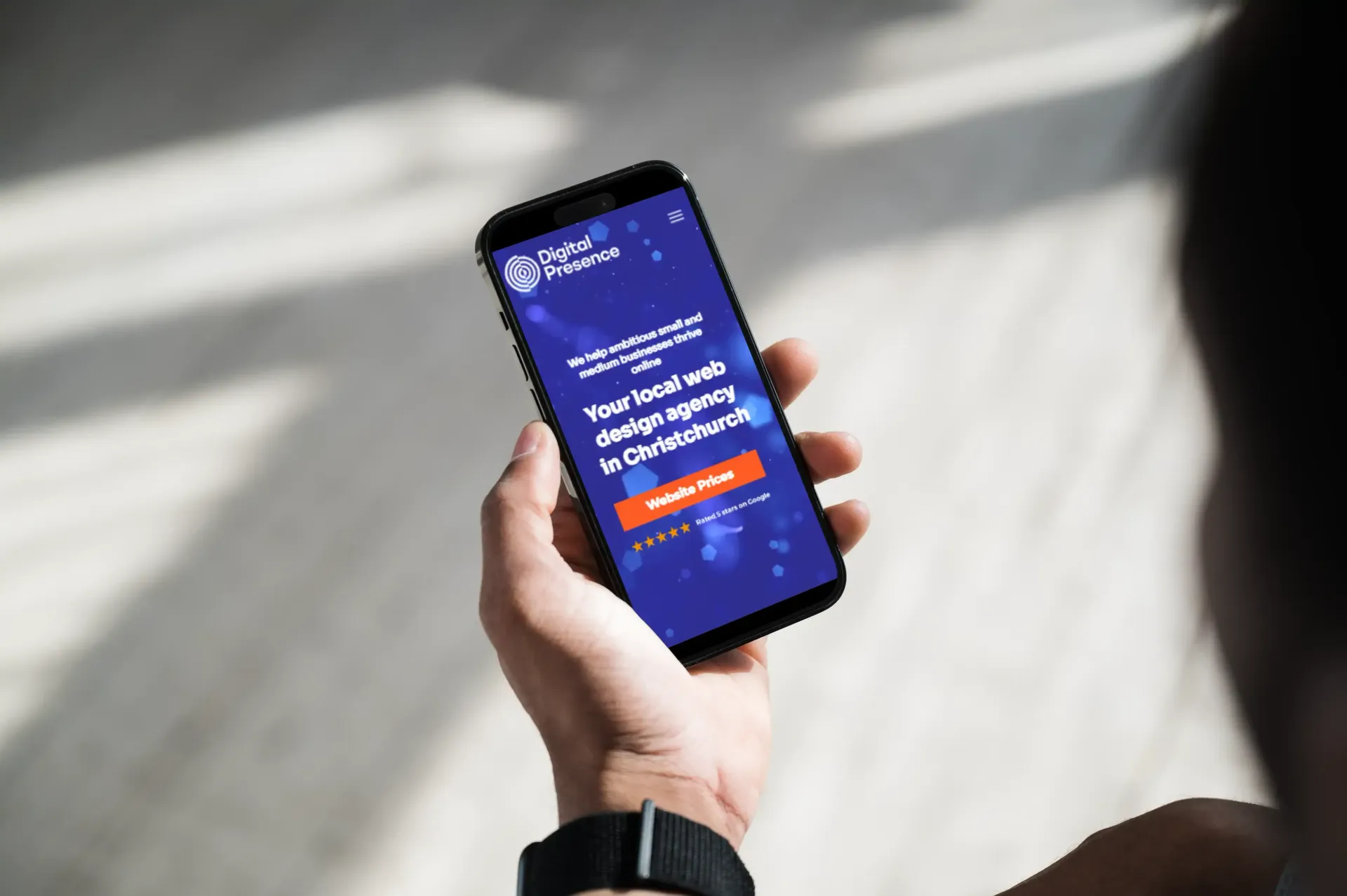 a person is holding a cell phone in their hand .