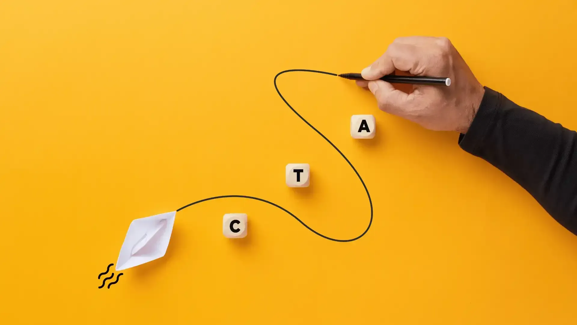 a person is drawing a kite with a pen on a yellow background .