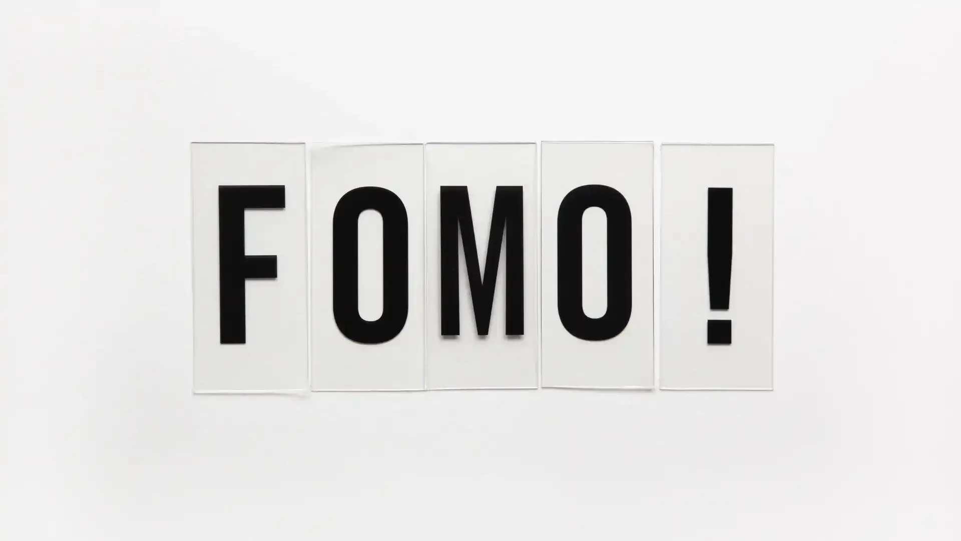 the word fomo is written in black letters on a white background .