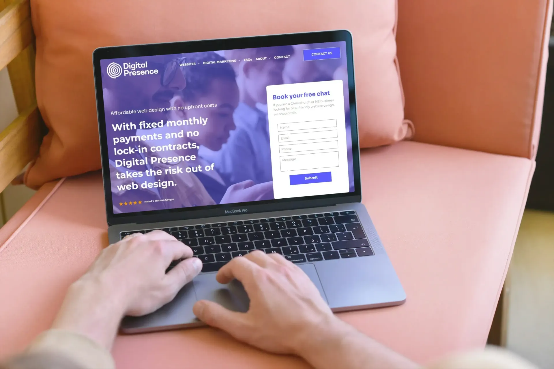 A person is typing on a laptop computer.