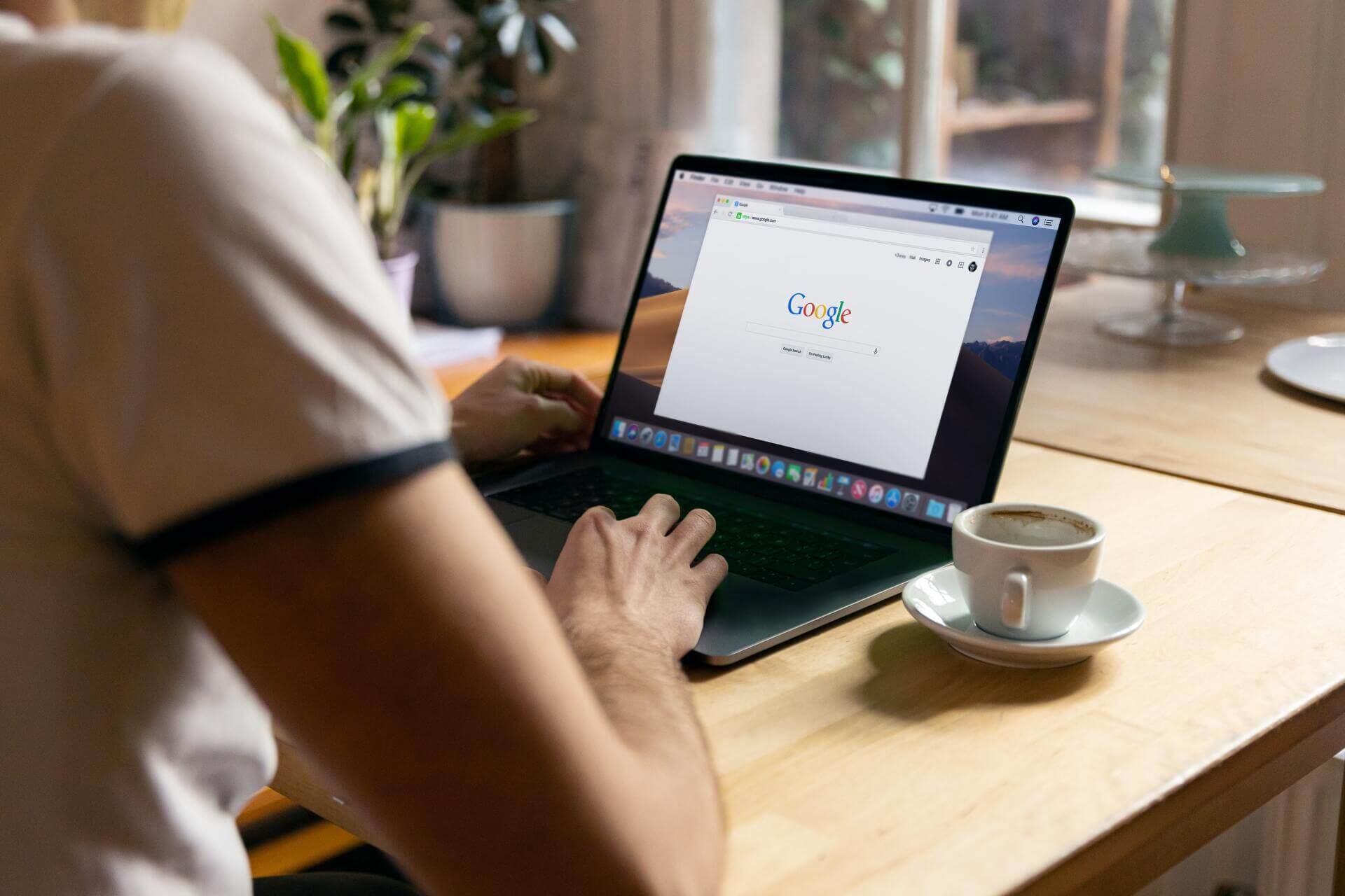 Man doing a Google search on their laptop