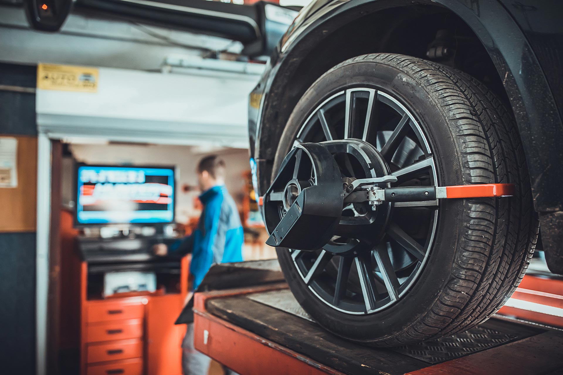 Wheel Alignment Equipment on a Car Wheel in a Repair Station | Helensvale, Qld | Ashtons Removals