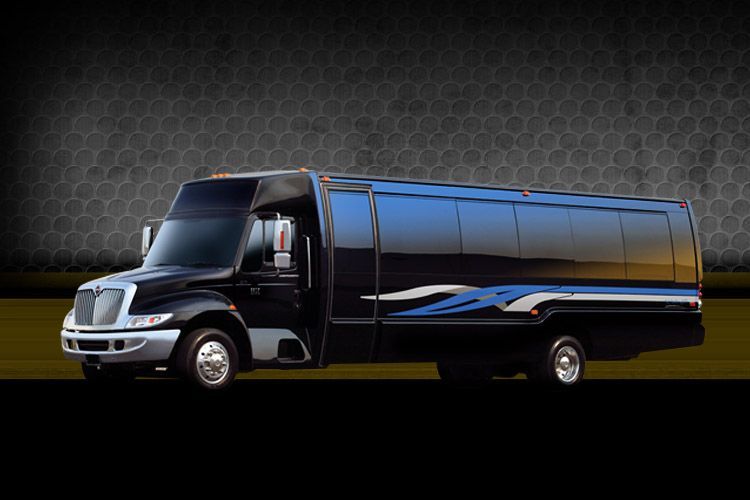 Black luxury shuttle bus with blue and silver accents on a dark background