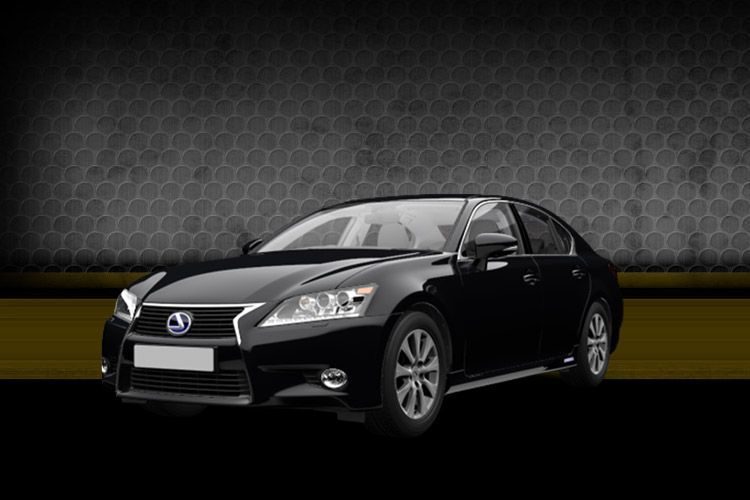 Black Mazda sedan on a dark studio background with a yellow stripe