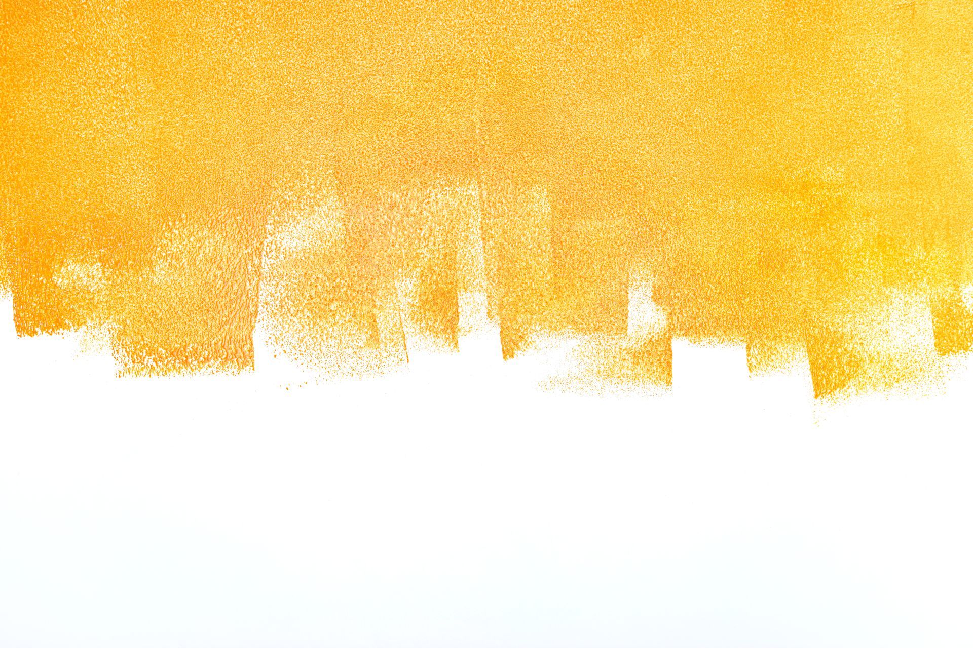 Yellow paint roller strokes on white background.