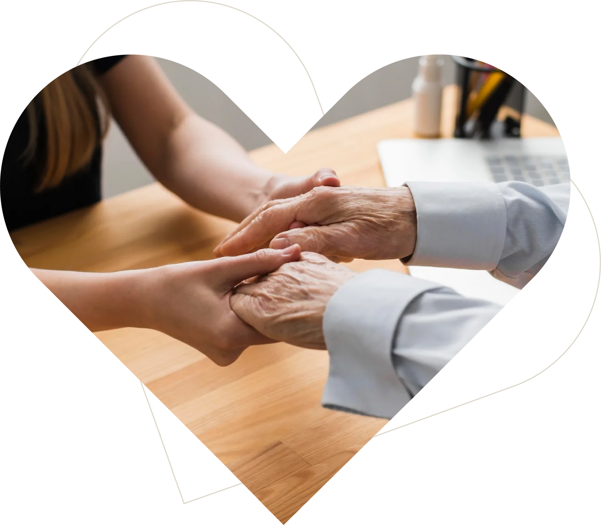 Caregiver gently holding a senior resident’s hands