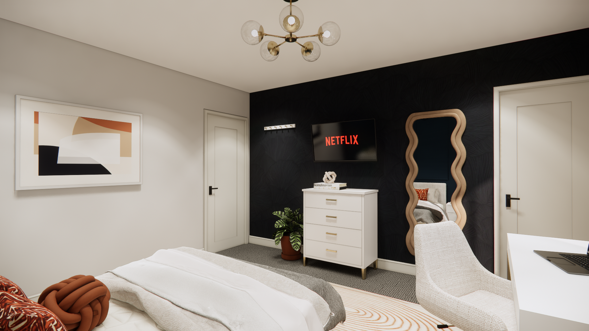 Bedroom with black accent wall, white dresser, and gold-framed mirror.