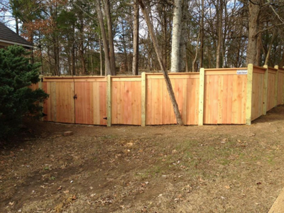 privacy fence with trees in the background