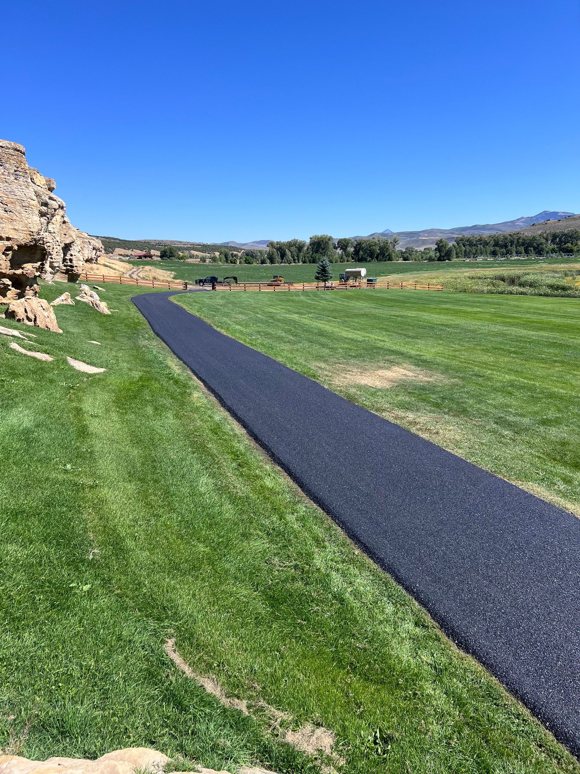 Picture of a paved road after the guys of fish on paving came by and paved this road. 