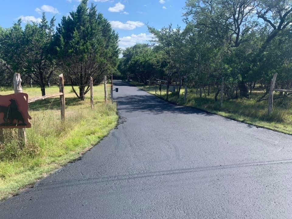 image of a sealcoat job in a ranch road.