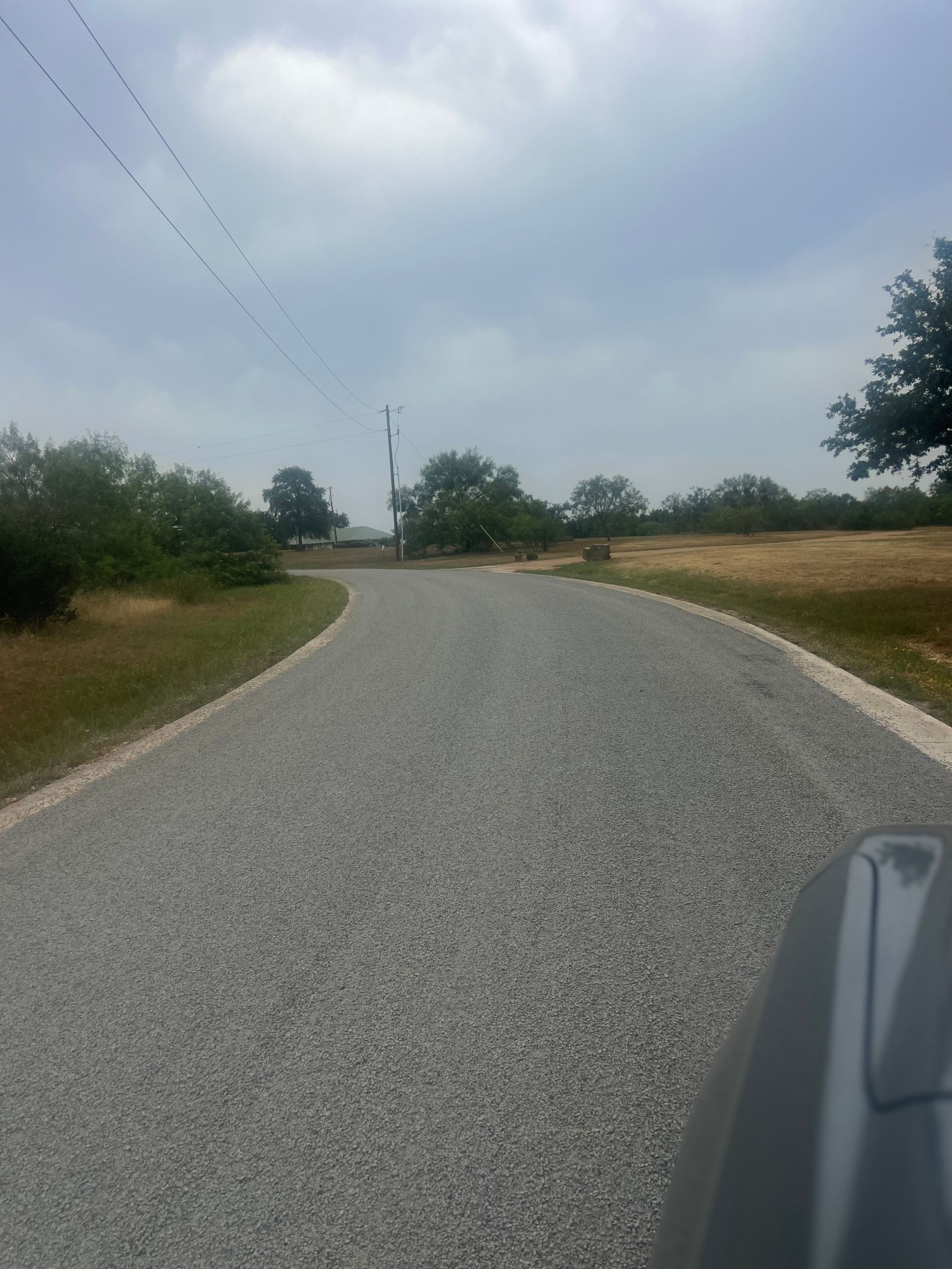 Picture of a chip sealed road in the middle of a natural reserve.