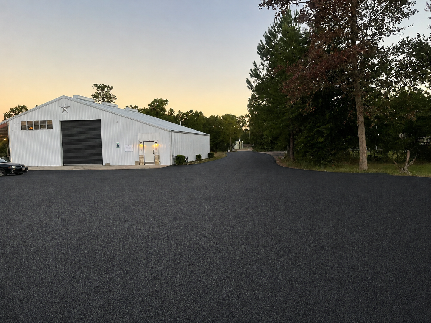 Fresh chip seal parking area and private road installation at a commercial property in Bozeman, Montana