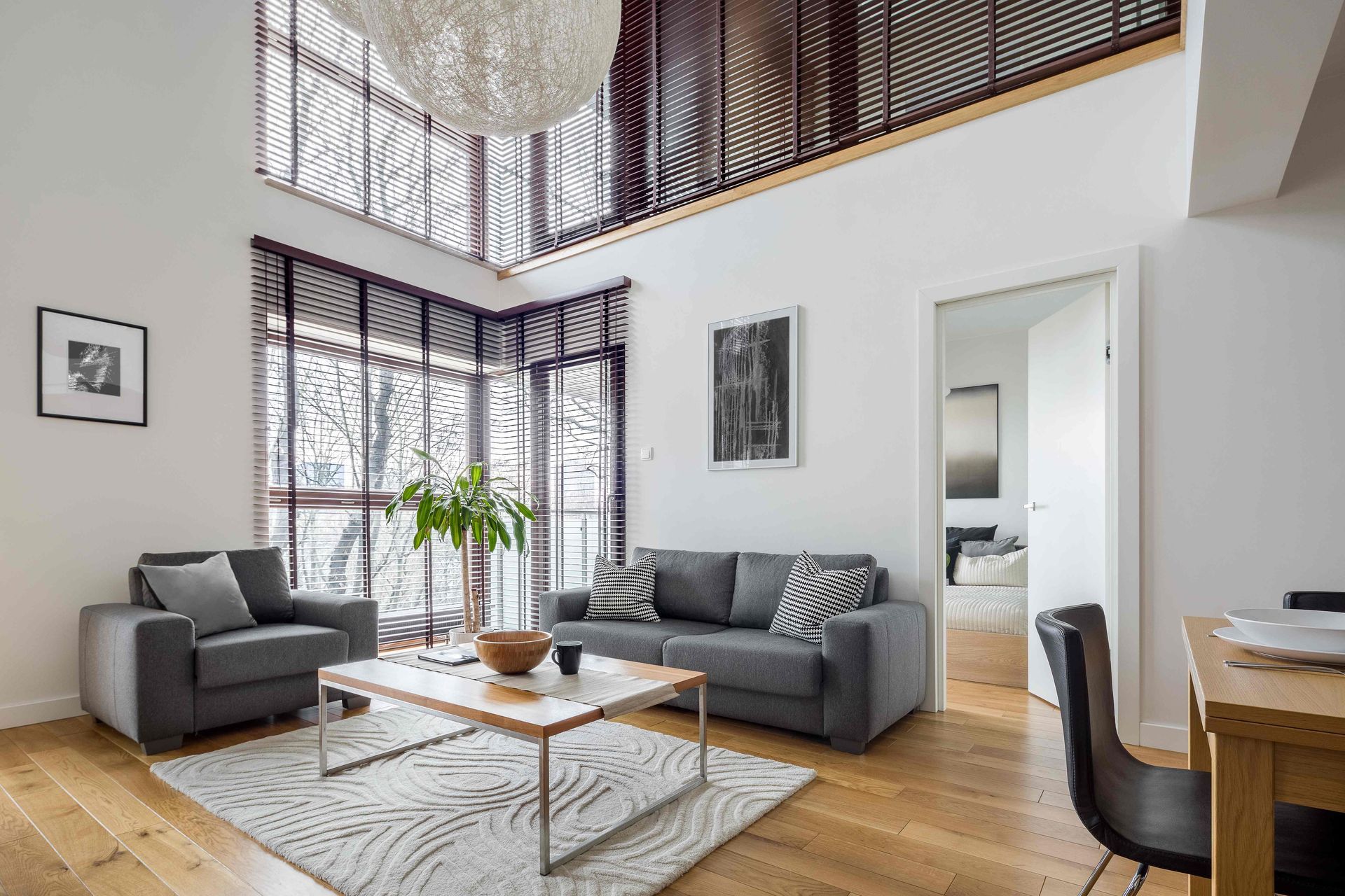  A contemporary living room with an open floor plan and stylish yet functional window blinds near Coeur d'Alene, ID