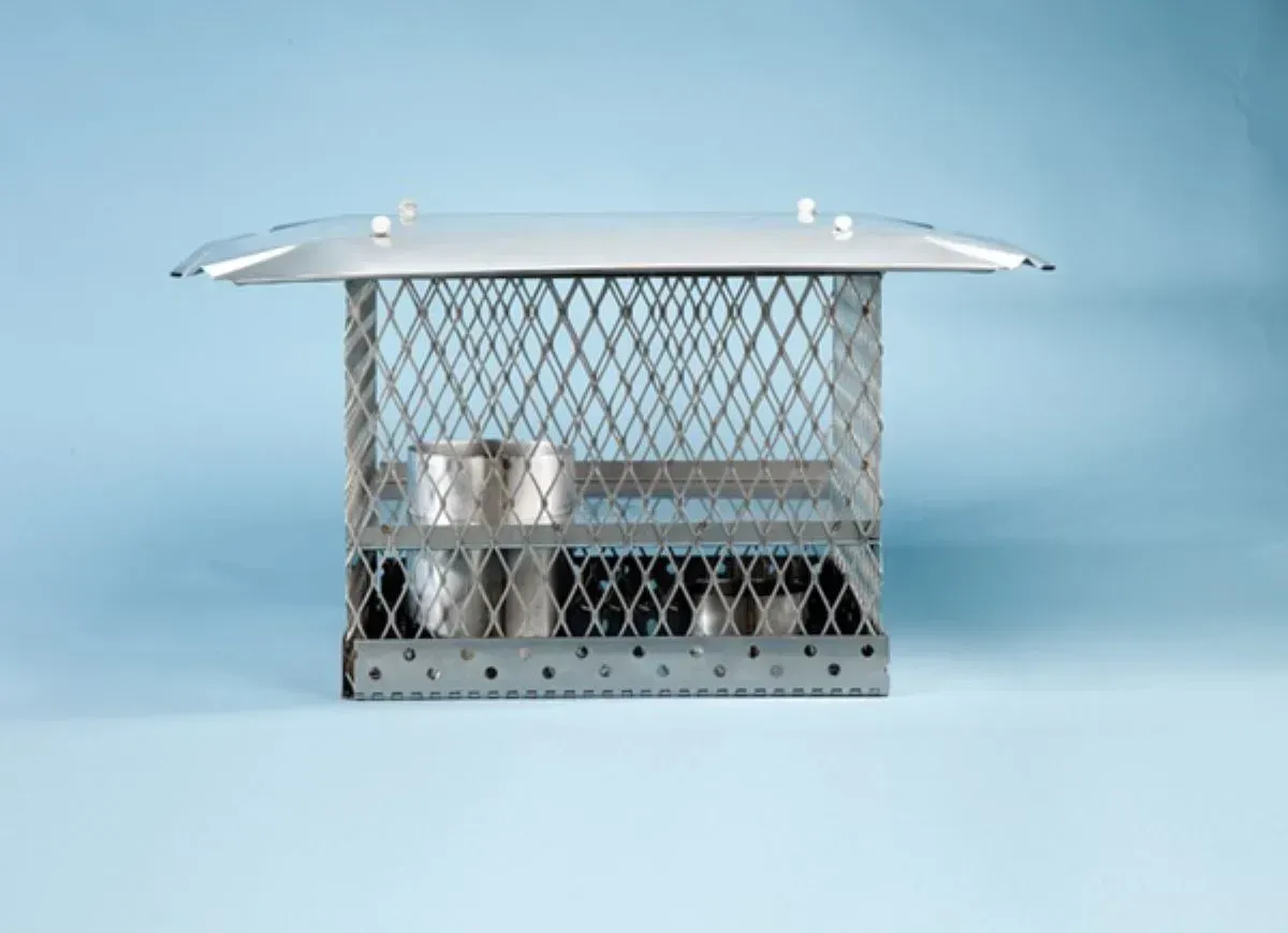 A metal cage is sitting on a blue surface.