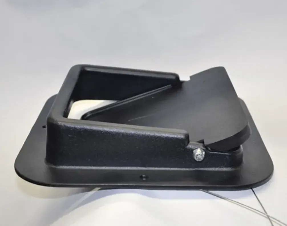 A black plastic item with a wire attached to it