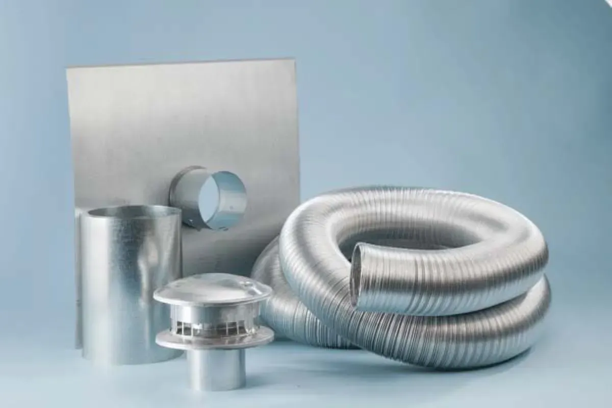 A bunch of metal pipes are sitting on a table.