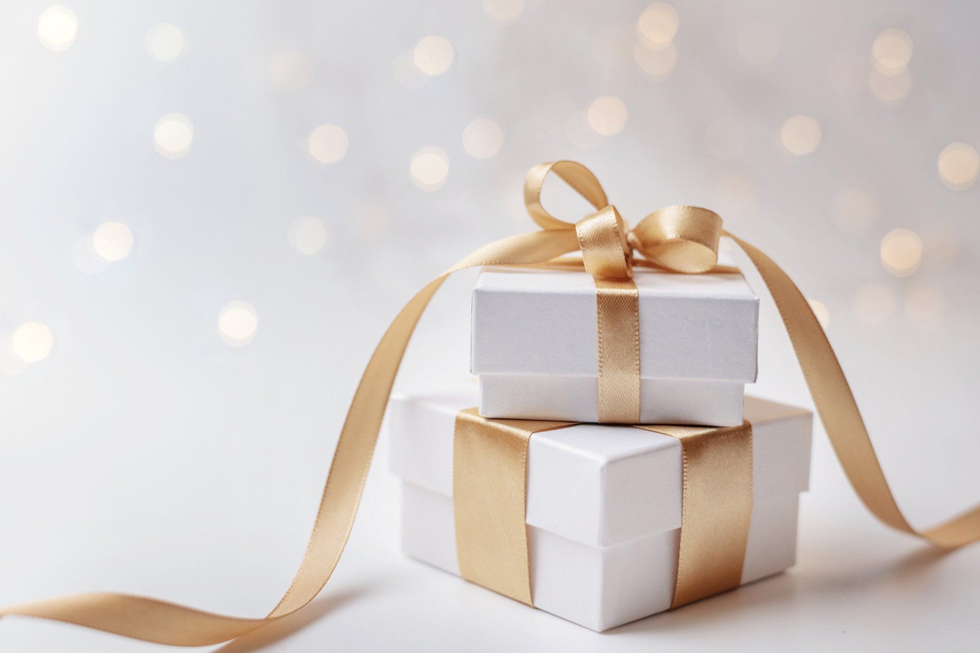 Two White Gift Box With Gold Ribbon — Stow, OH — Stow Mail Center Two White Gift Box With Gold Ribbon — Stow, OH — Stow Mail Center