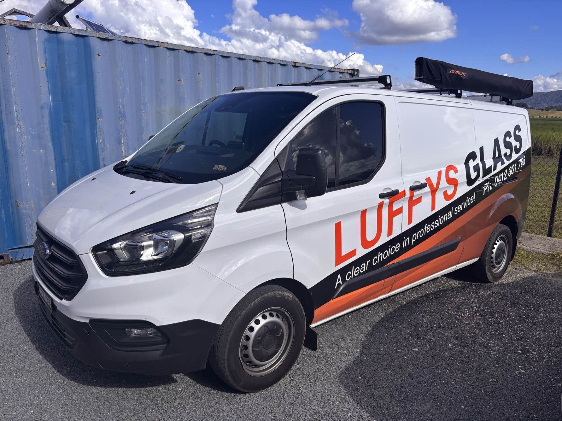 A Man is Installing a Window in a House — Luffys Glass in South Murwillumbah, NSW