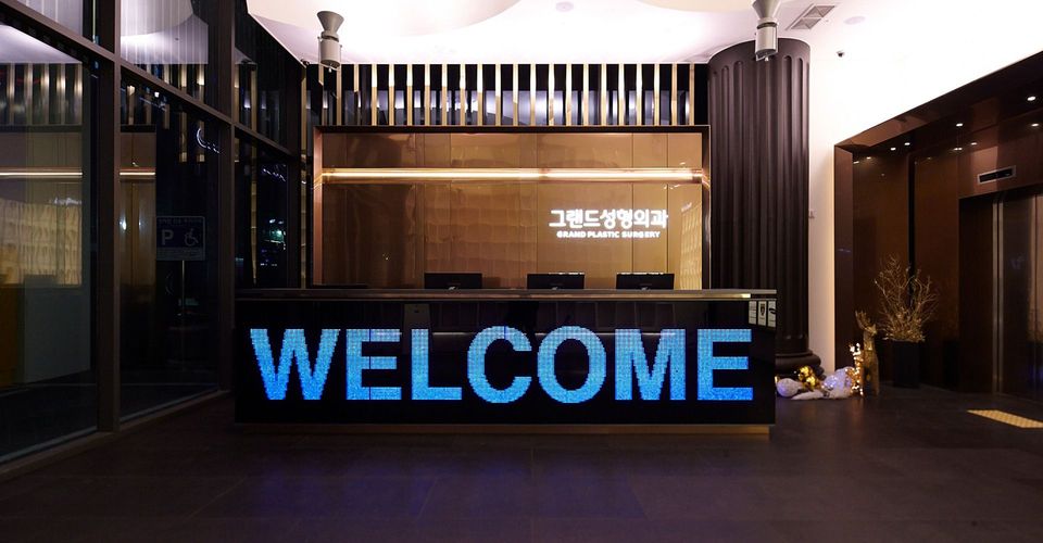 Reception of Grand Plastic Surgery with a welcome sign