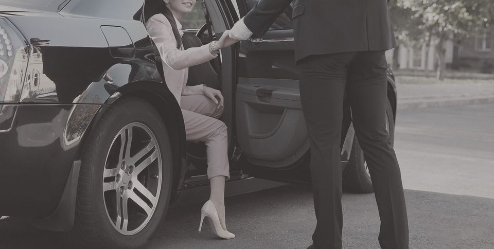 Driver welcoming a patient at the airport car