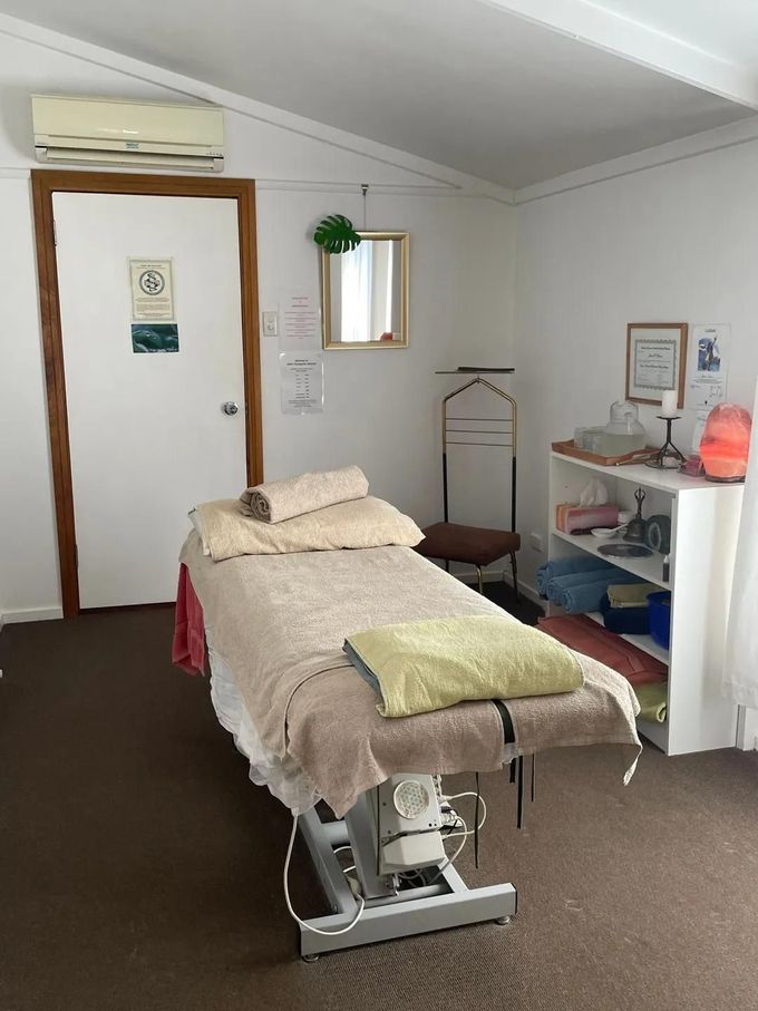 There Is A Massage Table In The Middle Of The Room — Aloha Therapeutic Massage In Gillen, NT