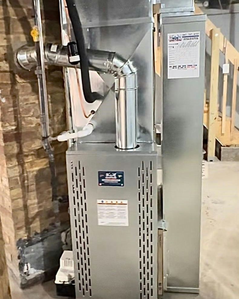 Basement HVAC furnace and ductwork beside a metal water heater and utility panel