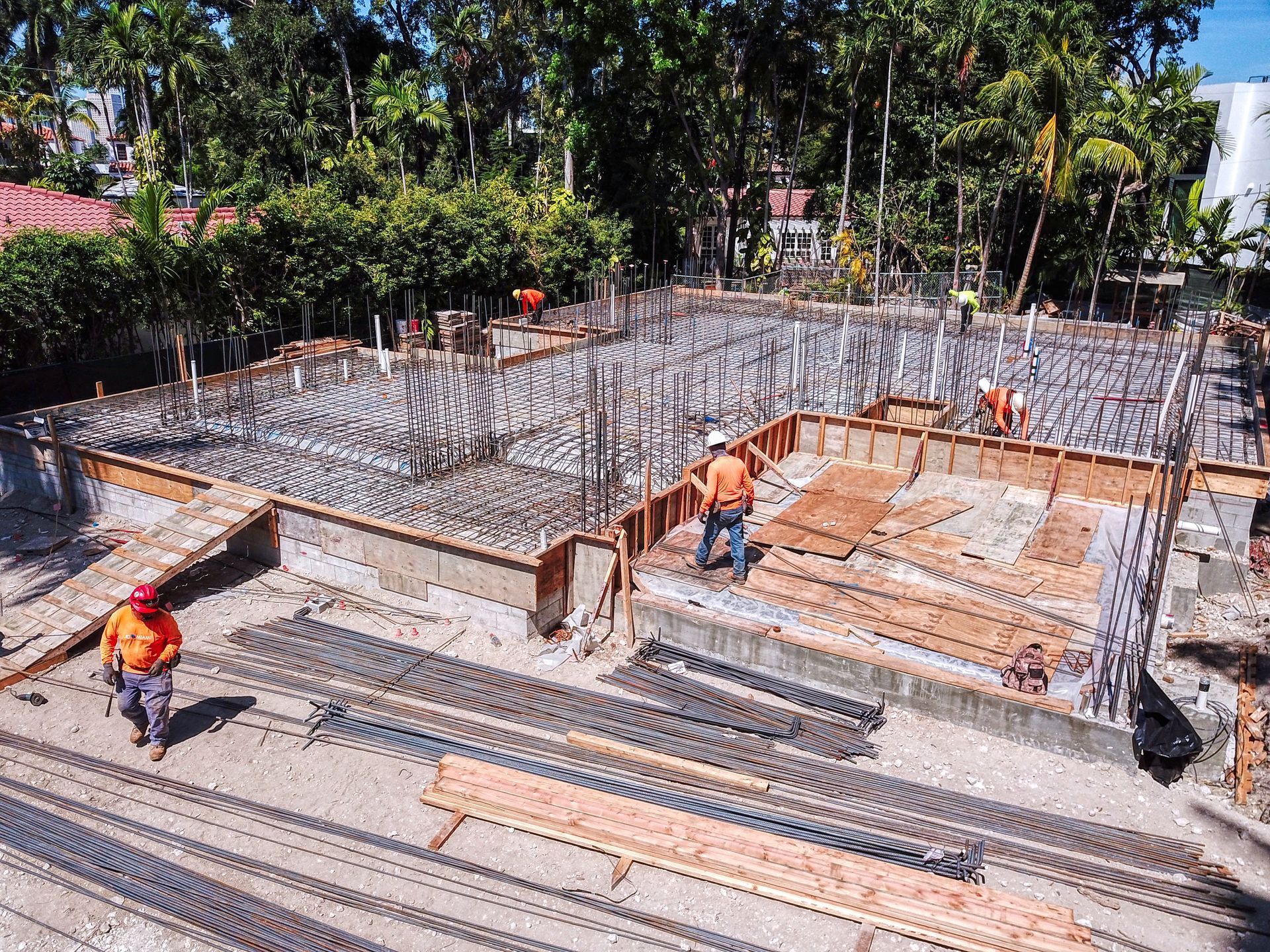 A group of construction workers are working on a construction site.