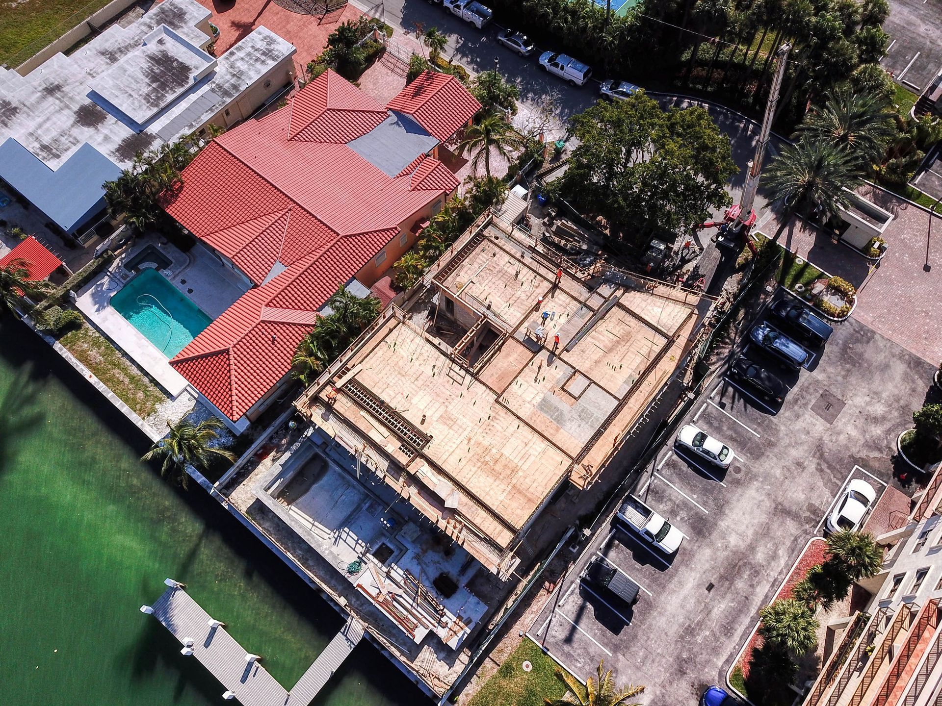 An aerial view of a residential area with a swimming pool