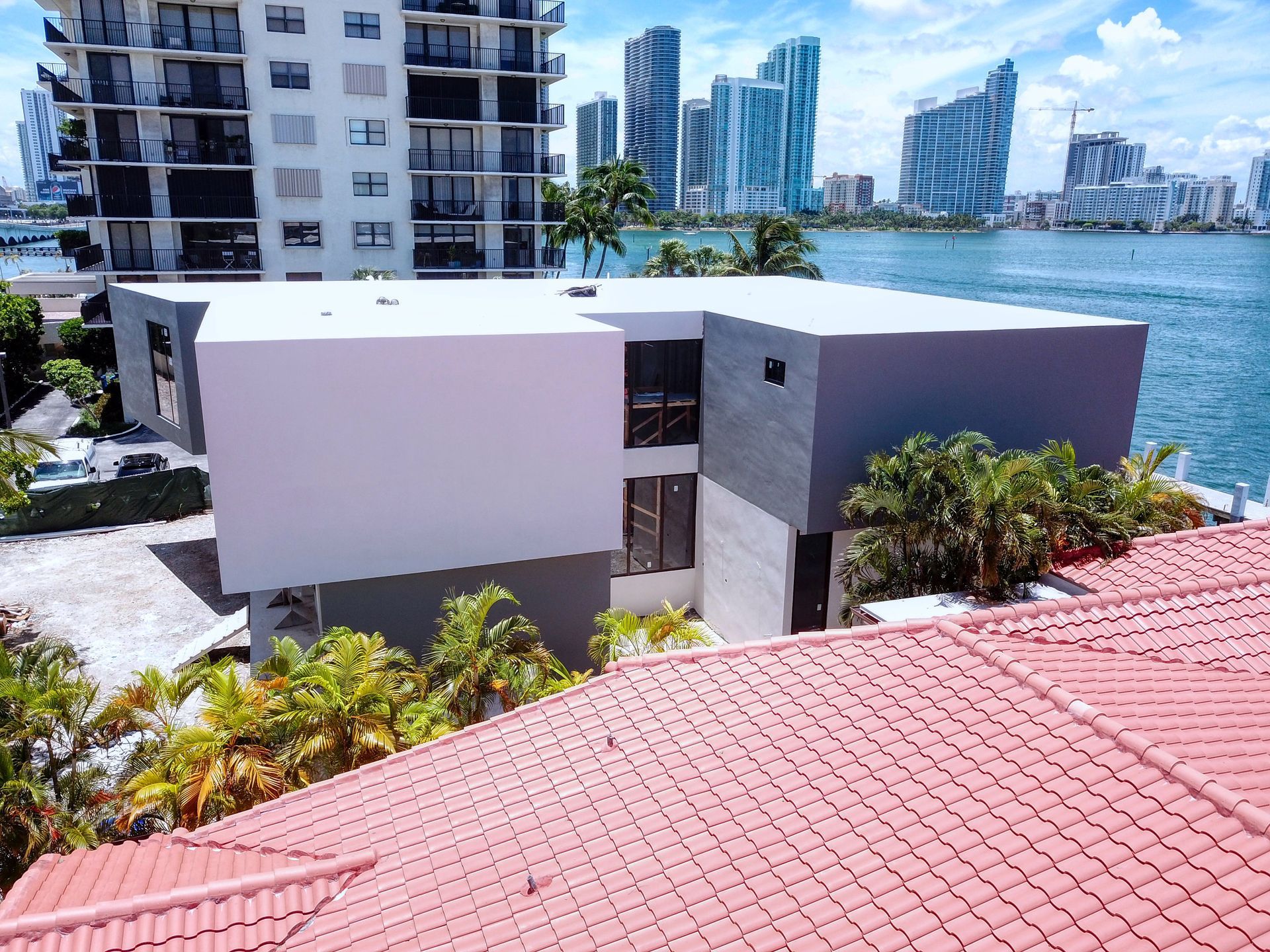 An aerial view of a building with a red roof