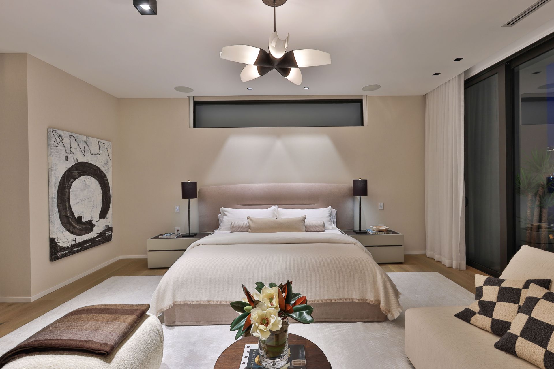 A bedroom with a large bed and a couch