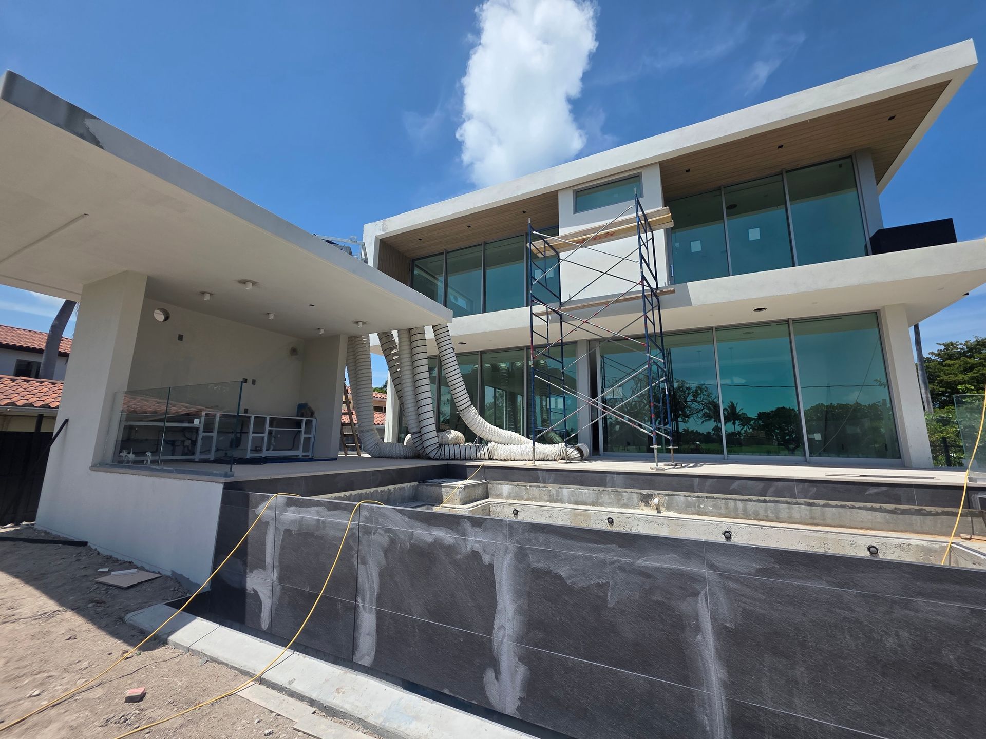 A large house with a lot of windows is being built