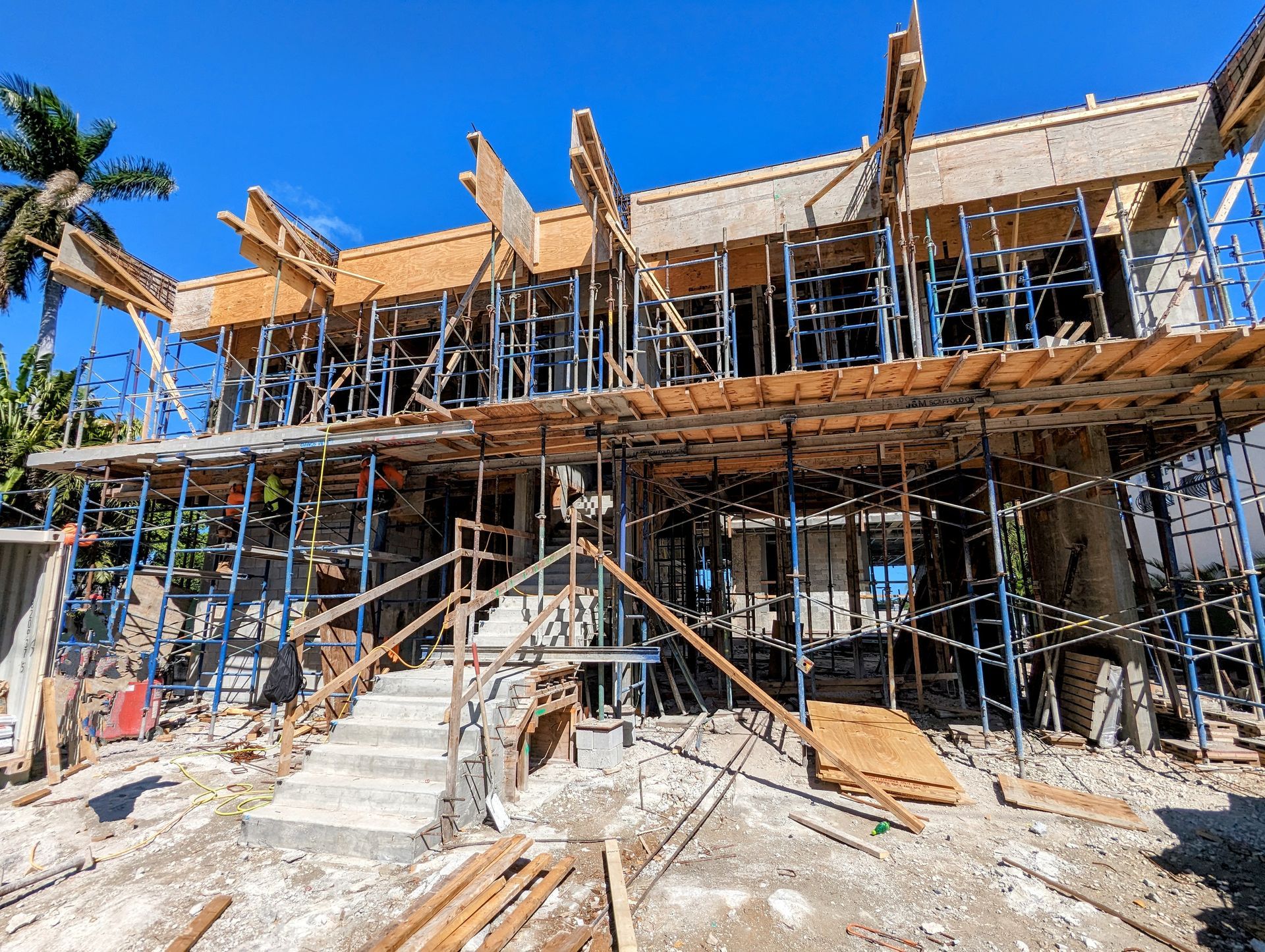 A large house is being built with scaffolding around it.