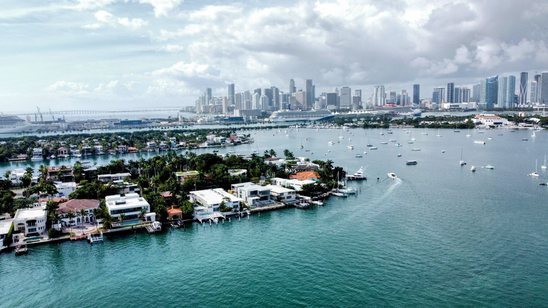 An aerial view of a large body of water with a city in the background