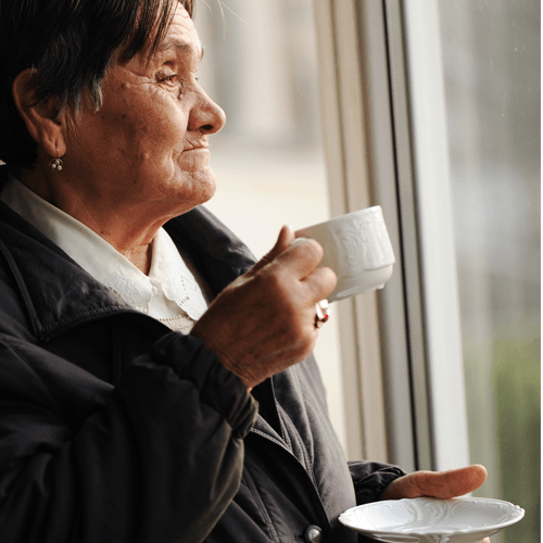 Older woman drinking tea
