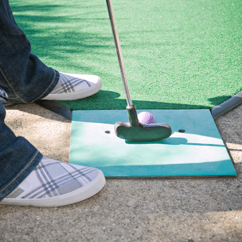 A golf putt on a green