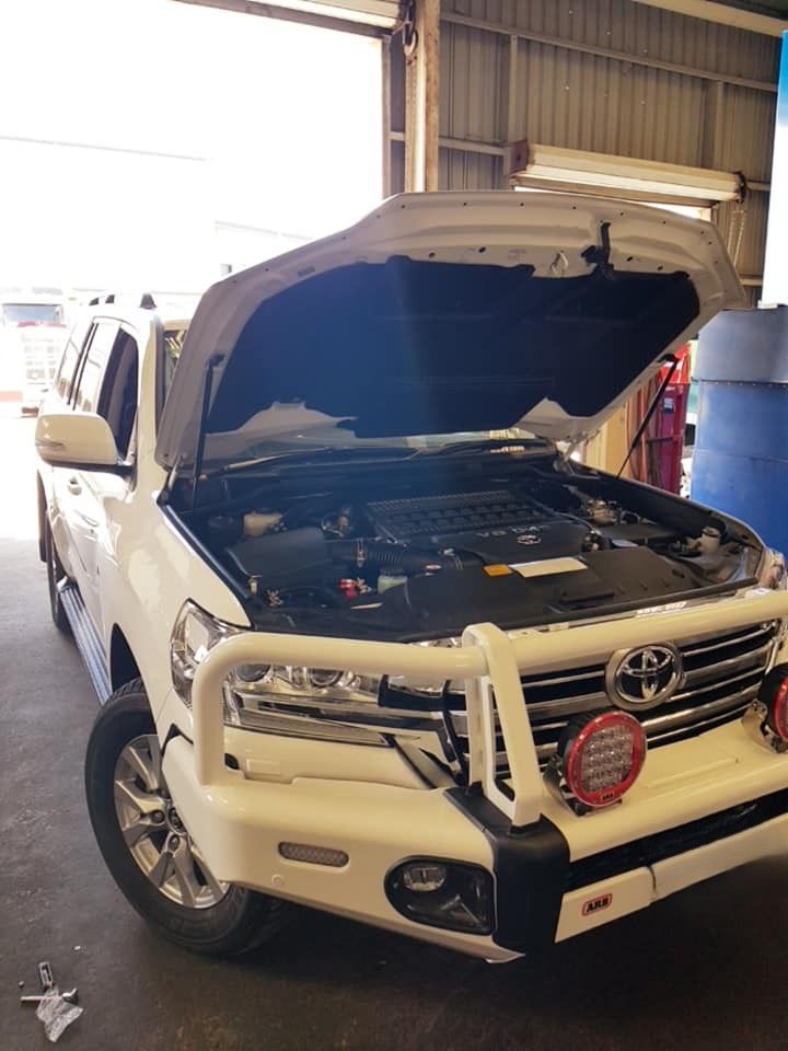 A White Suv With the Hood Open is Parked in a Garage — Drinnan's Diesel & Automotive Repairs In Gladstone Central, QLD