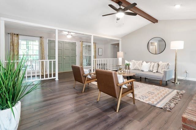 a living room with a couch and two arm chairs