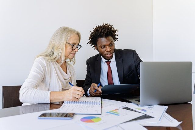 two property managers looking at a computer