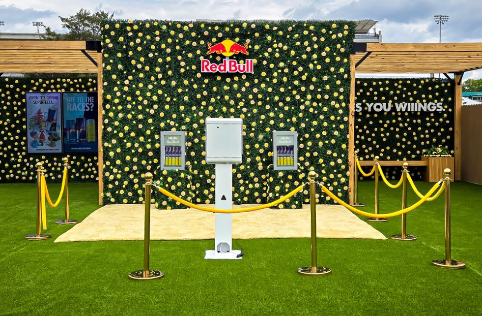 Red Bull branded portrait booth in front of a yellow flower wall in the infield at Churchill Downs