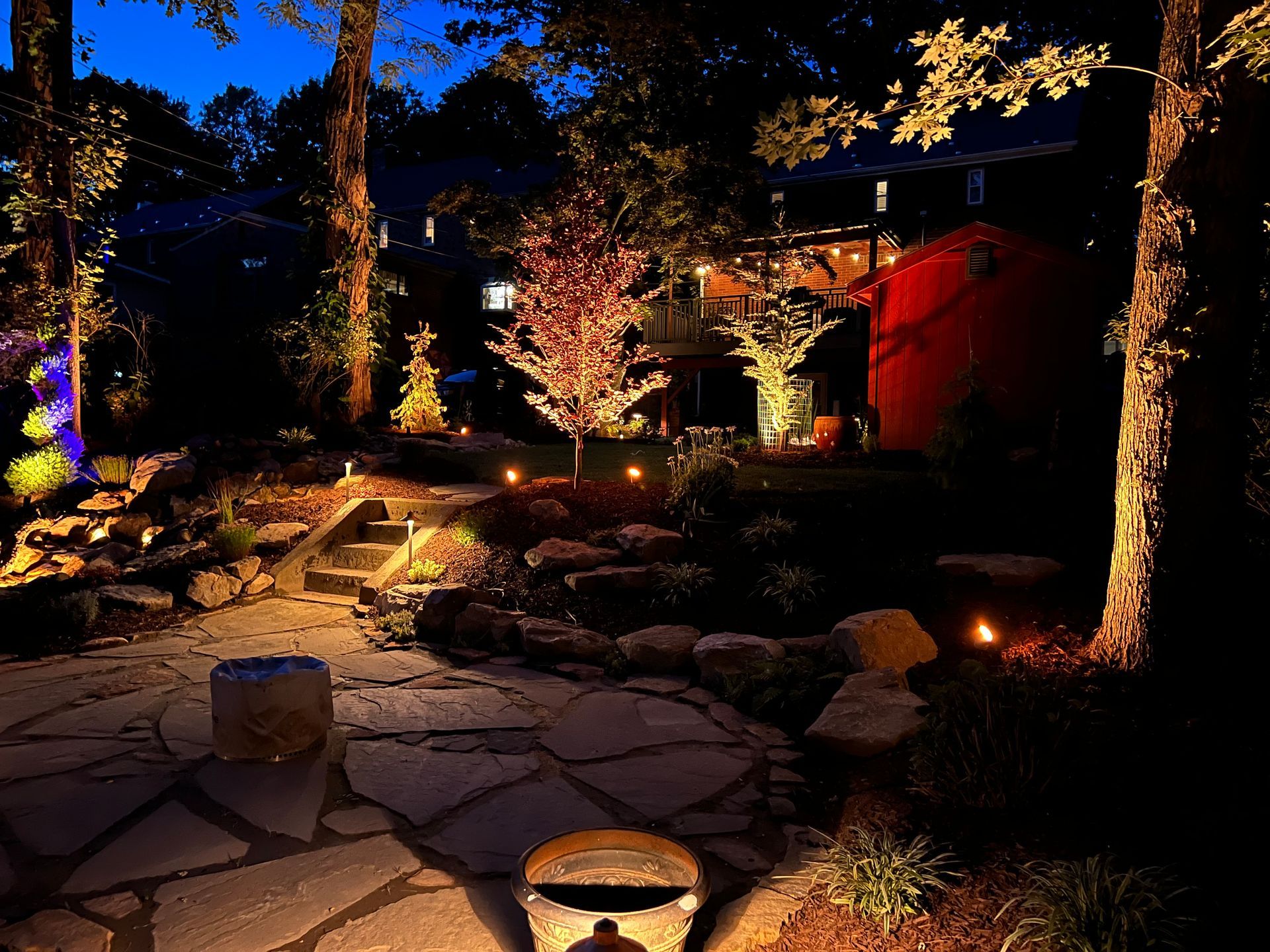 outdoor lighting featured at night on a fully designed landscape