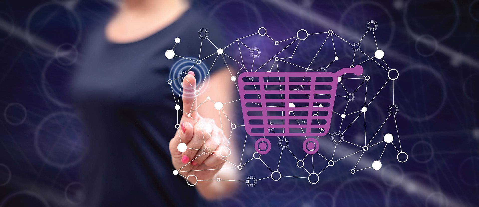 a woman is pointing at a shopping cart on a screen .