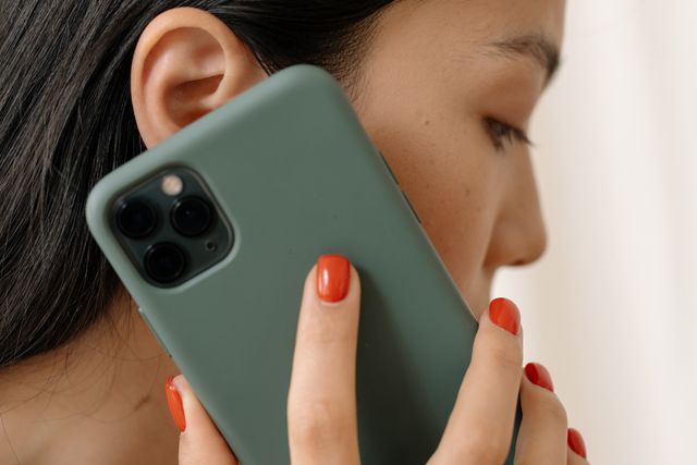 a person with their phone at their ear
