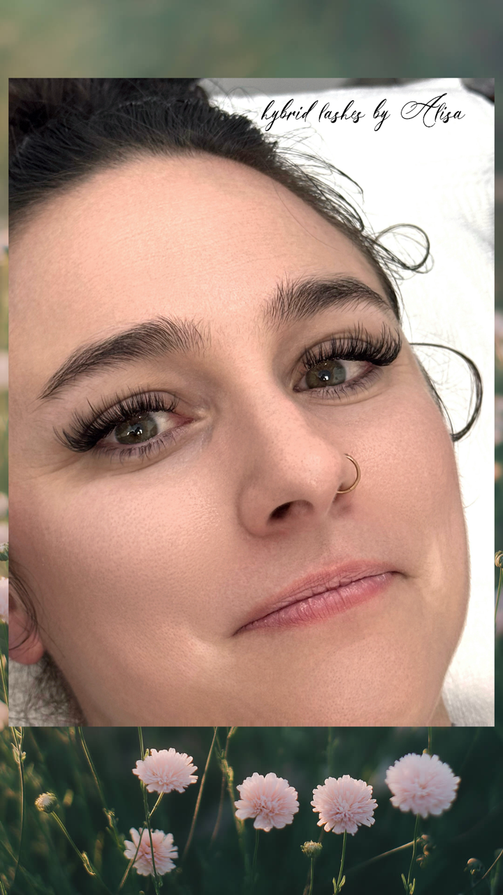 Woman with dark eyelashes, a nose ring, and subtle makeup, smiling.  Text at top: 