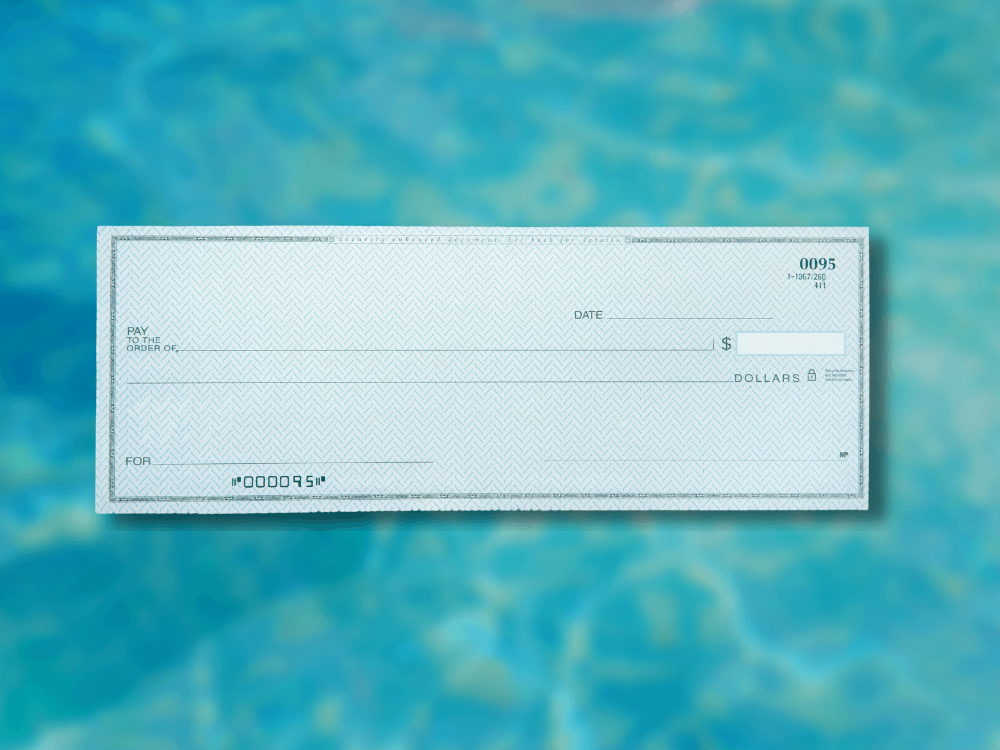 A check is sitting in front of a pool of water